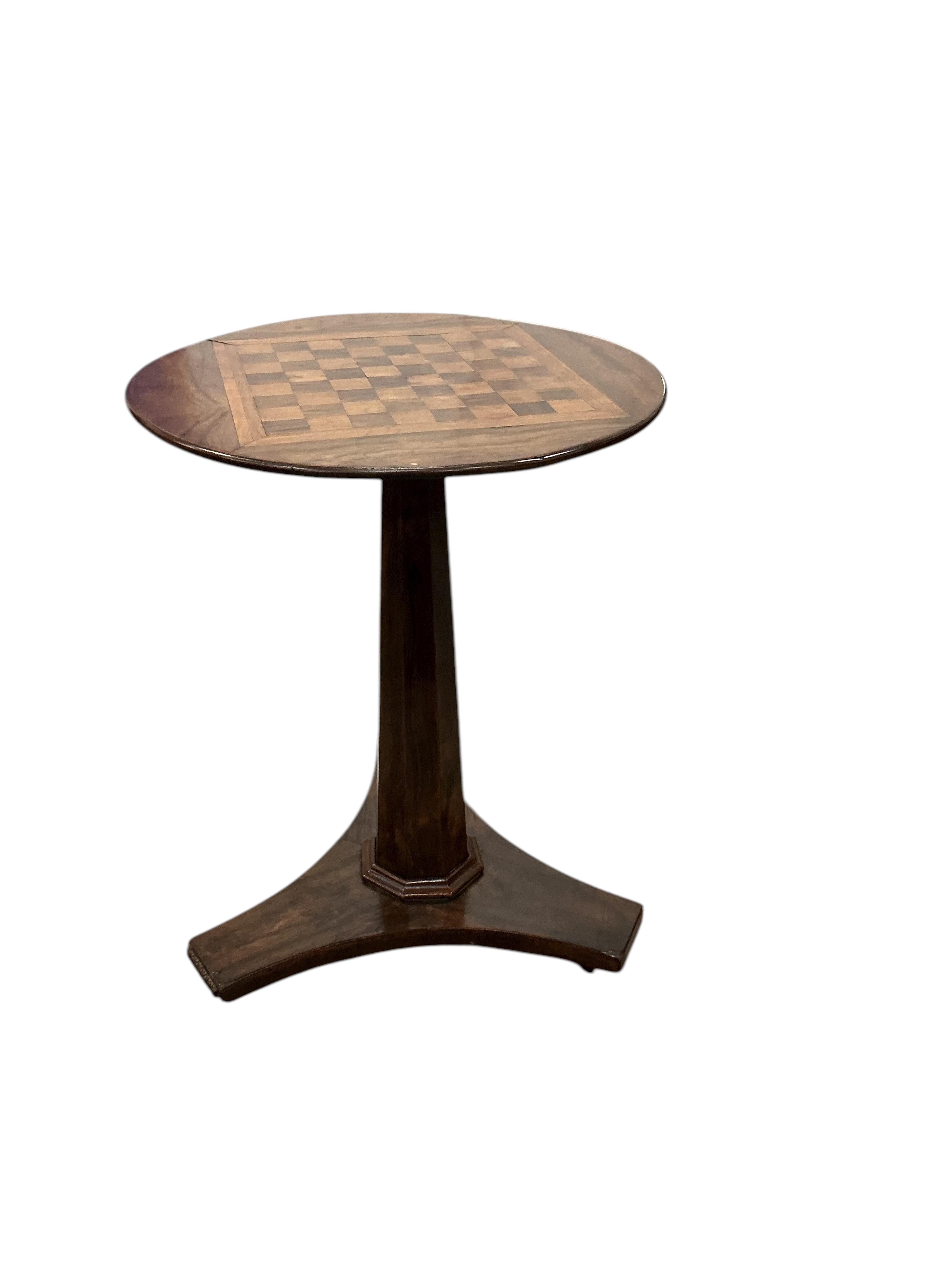 An early Victorian circular rosewood games table with chess board top, diameter 45cm, height 61cm